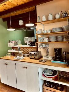 a kitchen with white cabinets and a counter top at Isla Bella in Ushuaia