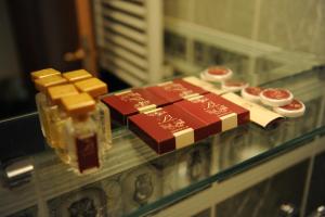 a glass table with a bar of chocolate and other desserts at Millenium Palace in Ohrid
