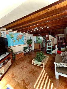 a living room with a large map on the wall at Isla Bella in Ushuaia