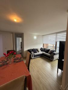 a living room with a couch and a table at Jacinta in Puerto Montt