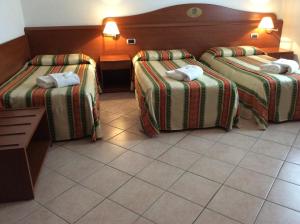 Katil atau katil-katil dalam bilik di Hotel Pizzeria Ristorante "Al Leone"
