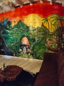 a mural painted on a wall in a room at Jungle house private room in Medellín
