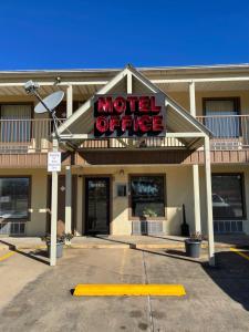 a motel office with a sign that reads motel office at All Star Inn in Bunkie