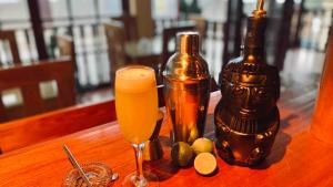 a bottle of beer and a candle on a table at Attic Hotel in Chachapoyas