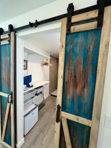 a sliding door in a room with a closet at Blue Cow Guest Farm in Cornville