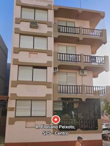a building with balconies on the side of it at 3D apartment, central - prox UFN in Santa Maria