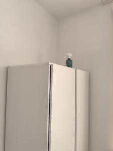 a white refrigerator with a bottle on top of it at Central Hostel Nurnberg in Nuremberg