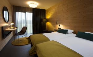 Łóżko lub łóżka w pokoju w obiekcie Hotel Remes