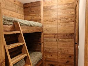 a cabin with wooden walls and stairs in a room at Le Cervin Lodge in Breuil-Cervinia