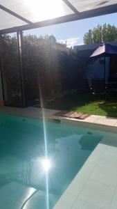 a person standing in the water in a swimming pool at Cassara Retreat in La Consulta +24 photos