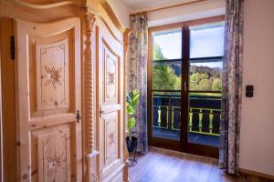 an empty room with a door and a window at Landhaus Waibel in Blaichach