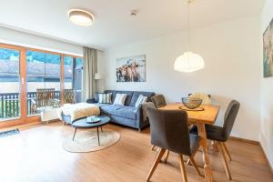 a living room with a couch and a table at Gipfelliebe in Bad Hindelang +1 photo