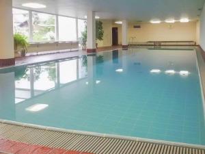 a large swimming pool in a large building at Entschenkopf in Bolsterlang