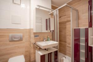 a bathroom with a sink and a toilet at Ferienwohnung Manns in Bad Hindelang