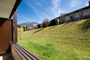 a view of a grassy hill from a house at Ferienwohnung Manns in Bad Hindelang