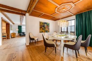 a dining room with a table and chairs at Landhaus Hoch 10 in Burgberg +14 photos
