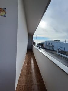 a view of a balcony with a view of a building at Fimar in Torre Lapillo
