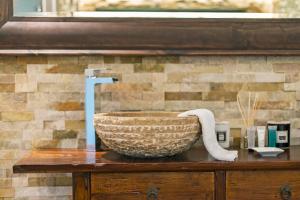 a bowl on a table with a towel on it at Tinwood Estate Vineyard Lodges in Chichester