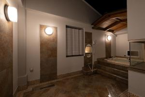 a bathroom with a tub and a sink at HOTEL MYTH-U -Adult only in Wakayama +58 photos