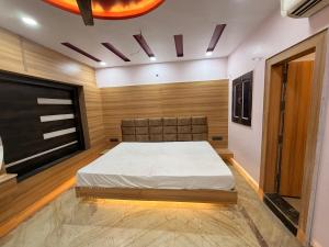 a bedroom with a bed in a room at Govindam Palace in Govardhan