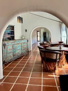 a restaurant with tables and chairs and a tiled floor at Casa Lavanda in San Miguel de Allende