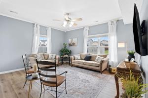 a living room with a couch and chairs at Spacious King Suite, Game Room, Patio, Firepit in Lexington