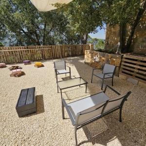 a group of chairs and a table and a fence at MiCastel in Ad Dawwār +3 photos