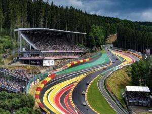 a race track with cars on a road with a crowd at Chic vintage apartment in Spa in Spa