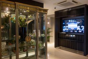 a display case in a store with a television in it at HOTEL MYTH-U -Adult only in Wakayama