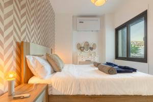 a bedroom with two beds and a window at Luna do Mar - Luxury apt with Jacuzzi in Gaula