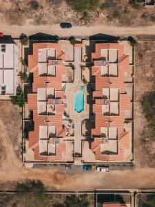 an aerial view of a building with a pool at Maluhia Home - Maio in Calheta Do Maio +8 photos