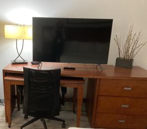 Televízia a/alebo spoločenská miestnosť v ubytovaní Orange Studios + 1 fotografia