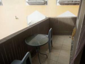 a small table and chair in a small room at Xiu Feng in Kenting