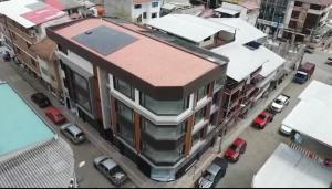 an overhead view of a building with a red roof at Ramon Luxury Suites in Gualaceo