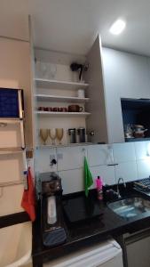 a kitchen with a counter with a toaster on it at Studio moderno e bem localizado in João Monlevade
