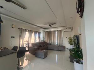 a living room with a couch and a table at IMSONG'S humble abode in Dimapur