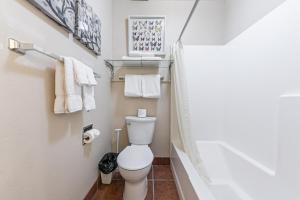 a small bathroom with a toilet and towels at Cozy Studio wKitchen #217 at Donner Lake Village in Truckee +13 photos