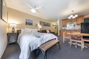 a large bedroom with a bed and a kitchen at Cozy Studio wKitchen #217 at Donner Lake Village in Truckee