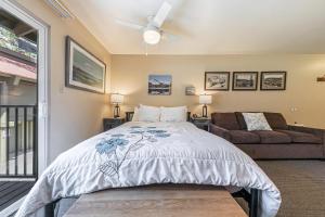 a bedroom with a bed and a couch at Cozy Studio wKitchen #217 at Donner Lake Village in Truckee