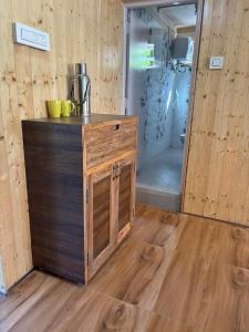 a wooden counter in a room with a shower at Paljor Farm in Ravangla