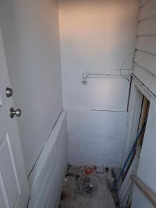 a corner of a bathroom with a white wall at Quiet Harrisburg home in Harrisburg +14 photos