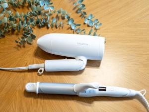 a wii remote sitting on a table with areath of flowers at 屋島base-最大10名 in Takamatsu