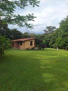 a house in the middle of a green field at Casa Solomaco in Vilcabamba +4 photos