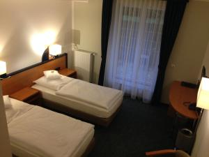 Postel nebo postele na pokoji v ubytování Hotel Zur Mühle