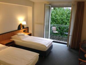 Postel nebo postele na pokoji v ubytování Hotel Zur Mühle