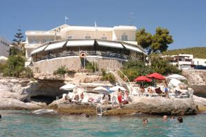 a group of people in the water at a resort at Panorama Hotel in Agia Marina Aegina