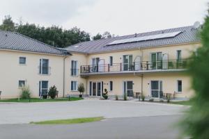 a building with solar panels on the roof at Casamia Hotel Spremberg in Spremberg