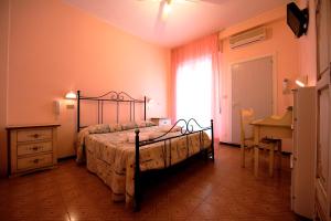 Postel nebo postele na pokoji v ubytování Hotel Settebello B&B + 37 fotografií
