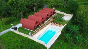 an aerial view of a house with a swimming pool at Dudu Cottage Nusa Penida in Nusa Penida