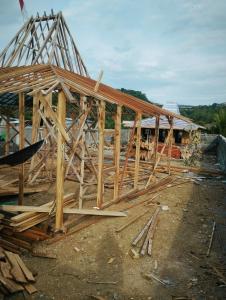 a house under construction with wooden framing at Dooz's place - Selong belanak in Selong Belanak